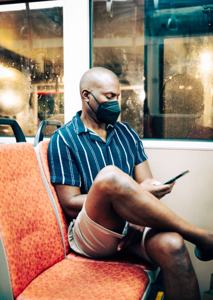 istock wearing mask in public transport 1482525796