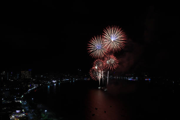 Huge beautiful firework over bay on beach, elegant celebration international firework over the beach of Pattaya , Tourism promotion