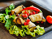 a plate of eggplant rolls. delicious snack of vegetables.