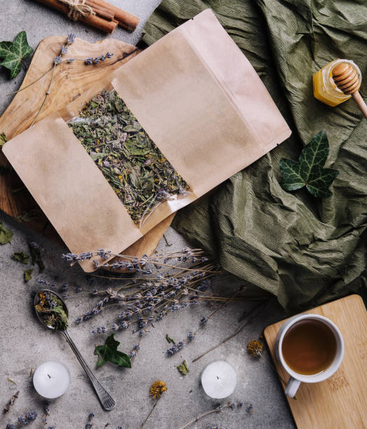 istock Dried and fresh tea leaves with tea, honey and cinnamon 1482535346