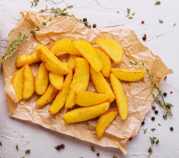 istock Baked fried potatoes with red and white sauces 1482535825