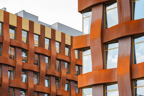 istock The brown facade of a stylish business building with modern architecture with a grid pattern against a blue sky. 1482536439
