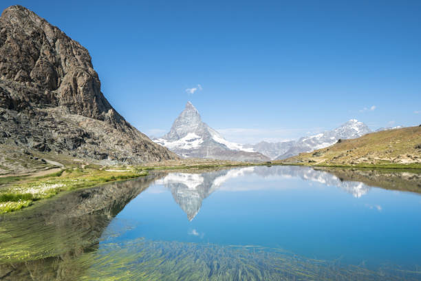 istock Matterhorn reflection in Riffelsee, Zermatt, Switzerland 1482538548