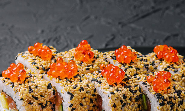 istock Sushi roll sprinkled with sesame seeds 1482539419