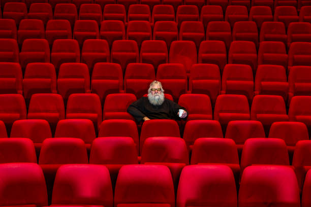 istock Concept loneliness :One man  sits in Empty cinema or theatre. 1482539489