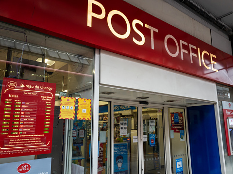 London. UK- 01.12.2021. The shop sign and entrance of a branch of the Post Office.