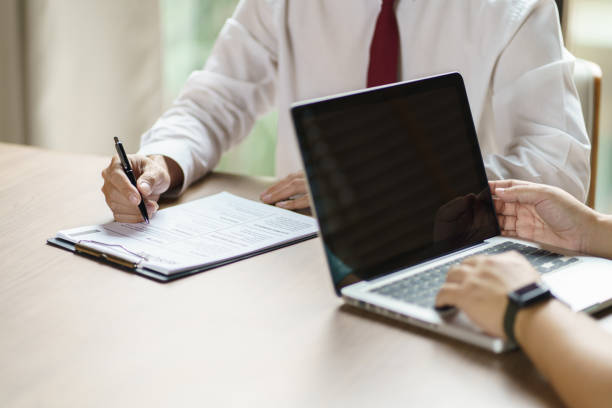 istock Examiner reading a resume during job interview at office Business and human resources concept 1482545259