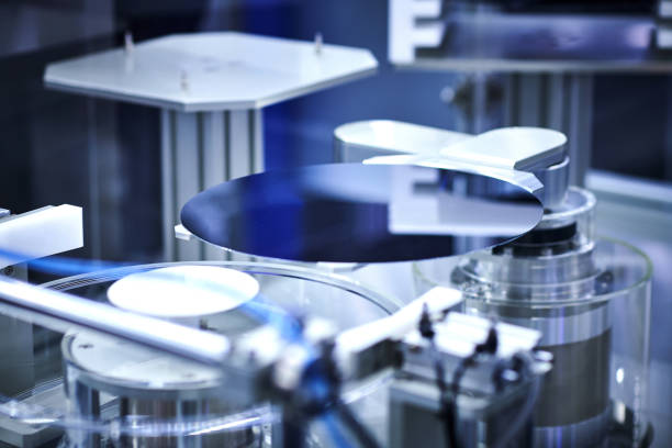 Computer Wafer on Robotic Arm at Production Line stock photo