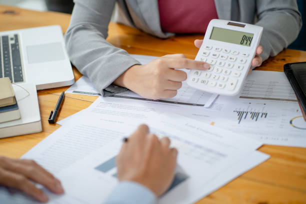 istock Team leader coach teach young workers explain on paper for business plan listen talkative coworker and discussing new project presentation Serious professional advisor consulting in office 1482546297