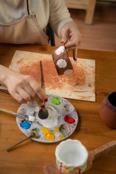 istock Woman painting a pottery 1482546448