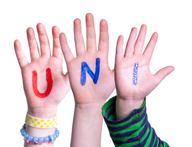 istock Children Hands Building Word Uni Means University, Isolated Background 1482550054