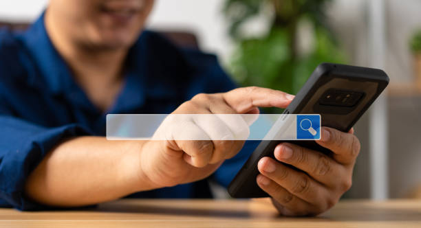 istock Businessman using a smartphone for searching information on the internet, searching browsing internet bar, Concept of Searching Browsing Internet Data Information Networking 1482550140