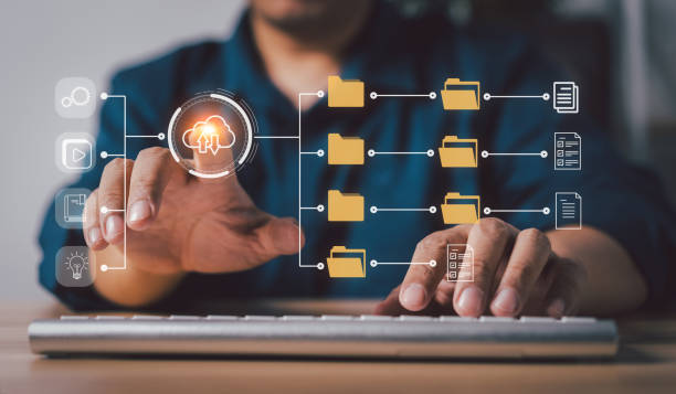 istock Businessman working on virtual screen of Document Management System (DMS). Software for archiving, searching, and managing corporate files and information, documentation in enterprise with ERP. 1482550150