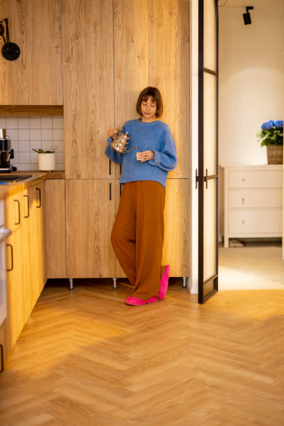istock Woman spending leisure time on kitchen at home 1482558661