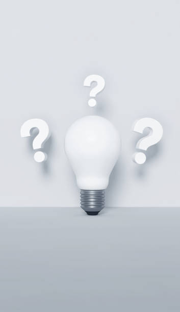 istock Innovation and new ideas concept. Question marks and a light bulb on white background. 1482561569
