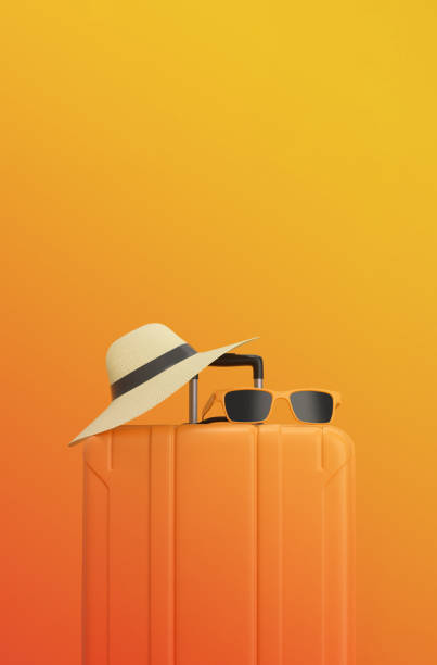 istock Summertime concept. Suitcase with sun glasses and hat on gradient sunset background. travel concept minimal. 1482561581