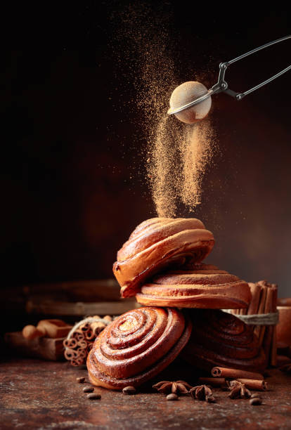 istock Sweet buns sprinkled with cinnamon powder. 1482562792