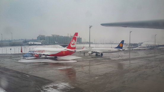 Munich, Germany - January third 2016 - Air Berli and Lufthansa Planes Parked in Munich Airport Ramp