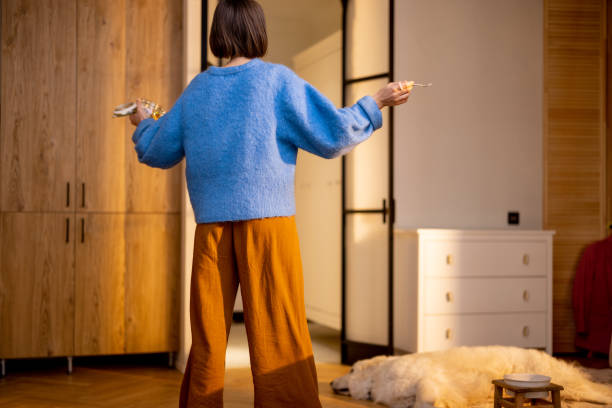 istock Happy woman dancing during a breakfast time at home 1482563158