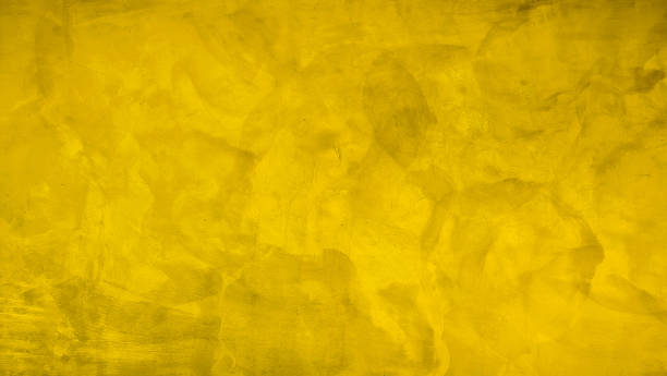 istock yellow empty stucco cement for editing text present on free space backdrop. yellow stucco concrete wall, architectural exposed stucco concrete wall used as background for vintage concept design. 1482564448