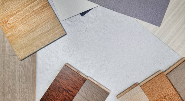 istock modern inspired interior finishing material samples for selection contains muti color wooden laminated flooring tiles, interior grey and beige wallpaper, vinyl flooring tile on stone background. 1482564461