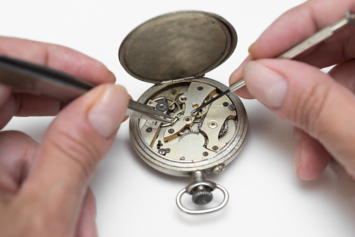 Holding an antique brass compass