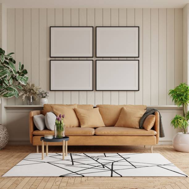istock Mockup poster frame on the wooden wall with leather sofa and decorating. 1482566780