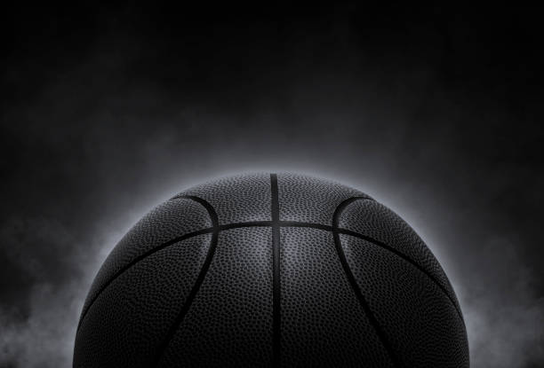 istock black basketball on smoke background. 3d render 1482566907
