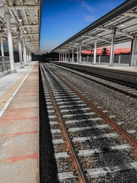 istock a train station with an empty track and a view of the sky 1482566929