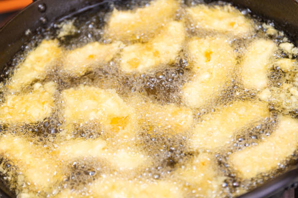 istock Cooking tempura in a large wok 1482570253