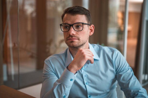istock Caucasian Businessman Wearing Eyeglasses In A Modern Office 1482570280