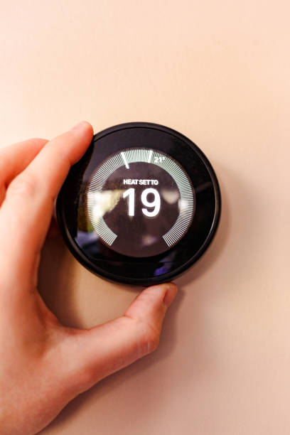 istock Regulating heating temperature with a modern smart thermostat 1482570581