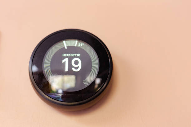 istock Modern smart thermostat on wall at home 1482570597
