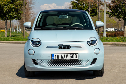 Berlin, Germany - 29th April, 2021: Electric car Fiat 500e on a street. This model is the first mass-produced electric car from Fiat.