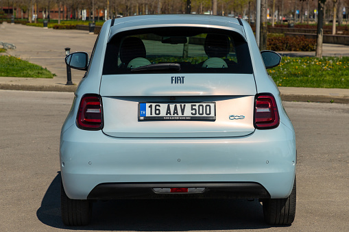 Istanbul, Turkey - April 13 2023 : Fiat New 500 also known 500e is a battery-electric car by Italian manufacturer Fiat. Rear view.