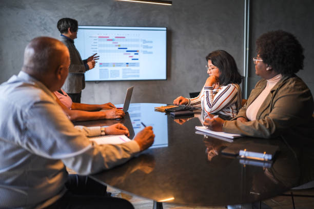 istock Businessman doing a presentation in a meeting at the office 1482574381