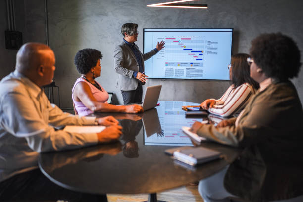 istock Businessman doing a presentation in a meeting at the office 1482574392