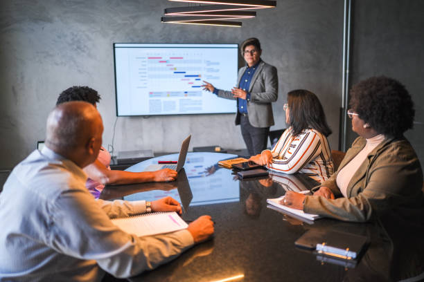 istock Businessman doing a presentation in a meeting at the office 1482574399
