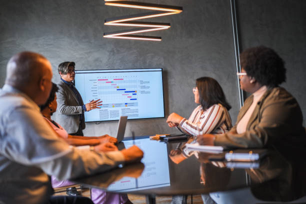 istock Businessman doing a presentation in a meeting at the office 1482574400