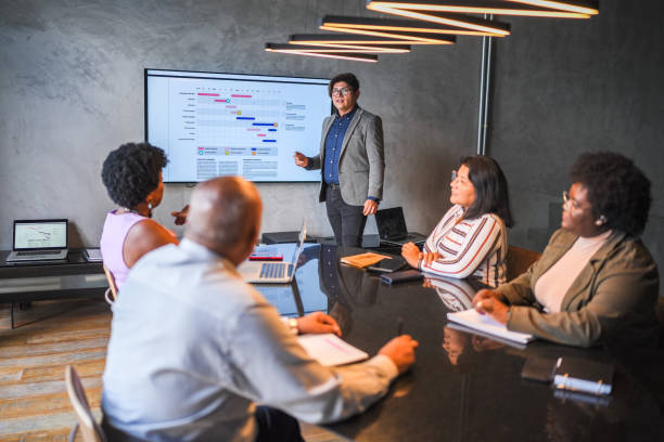 istock Businessman doing a presentation in a meeting at the office 1482574405