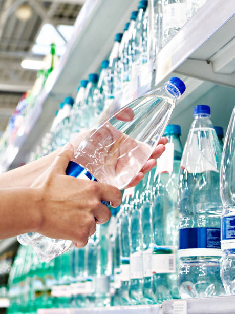 istock Drinking water in hand at shop 1482583696