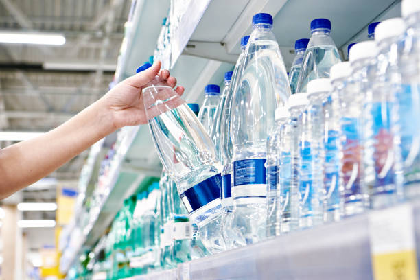 istock Drinking water in hand at shop 1482583766