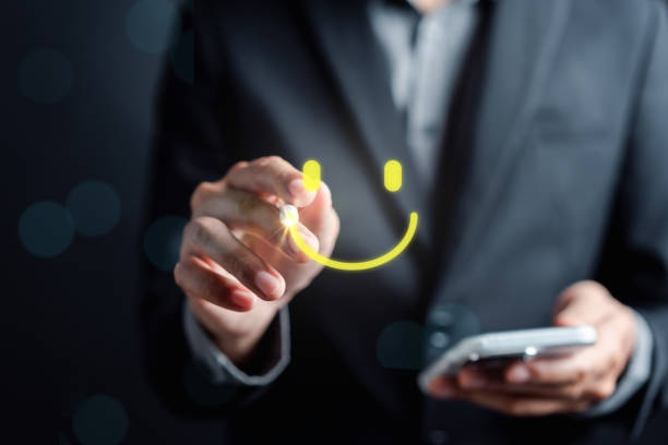 Customer Satisfaction Survey, Businessman holding Smile icon satisfaction, service experience rating online application, customer evaluation product service quality, satisfaction feedback review.