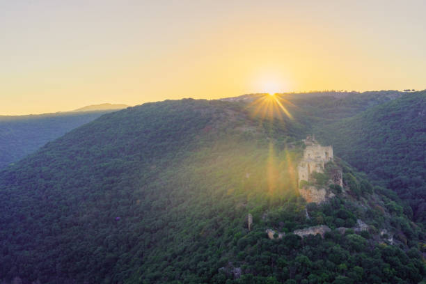 View of the sun rises over the Crusader Montfort Castle and the Kziv stream valley, in the Upper Galilee, Northern Israel