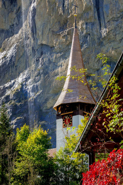 Lauterbrunnen church near Staubbach waterfall, Switzerland Church near Staubbach waterfall in Lauterbrunnen village, Berner Oberland, Switzerland, autumn summer view jungfrau stock pictures, royalty-free photos & images
