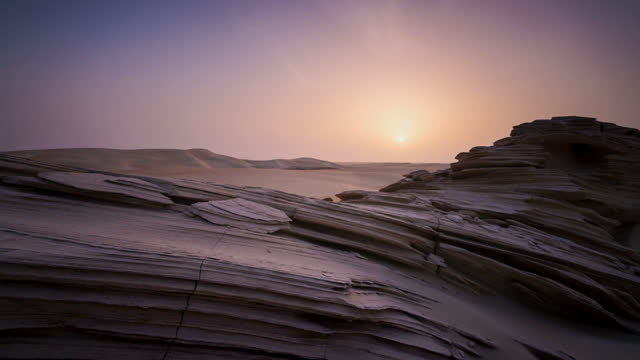 Beautiful sunrise sunset time lapse in the desert behind the fossils rock dune of Abu Dhabi