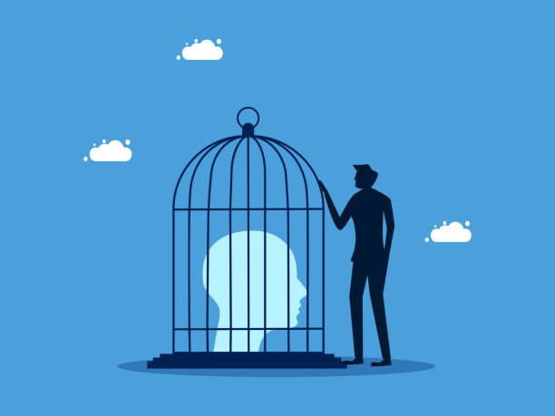 istock Control the thoughts in the human head. man locks a human head in a birdcage. Business concept 1482595961