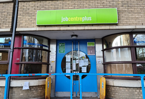 London. UK- 12.24.2020. The name sign and facade of a Job Centre.