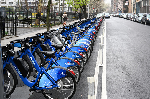 New York City, United States, April 5, 2023 - Row of Citi bicycle rental bikes at docking station in New York City near Broadway.