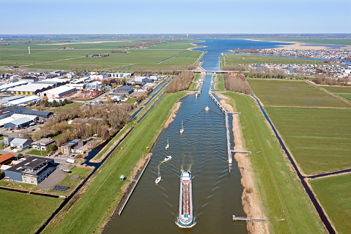 Aerial from freighter and sailing boats at the Prinses Margriet lock near Lemmer in Friesland the Netherlands
